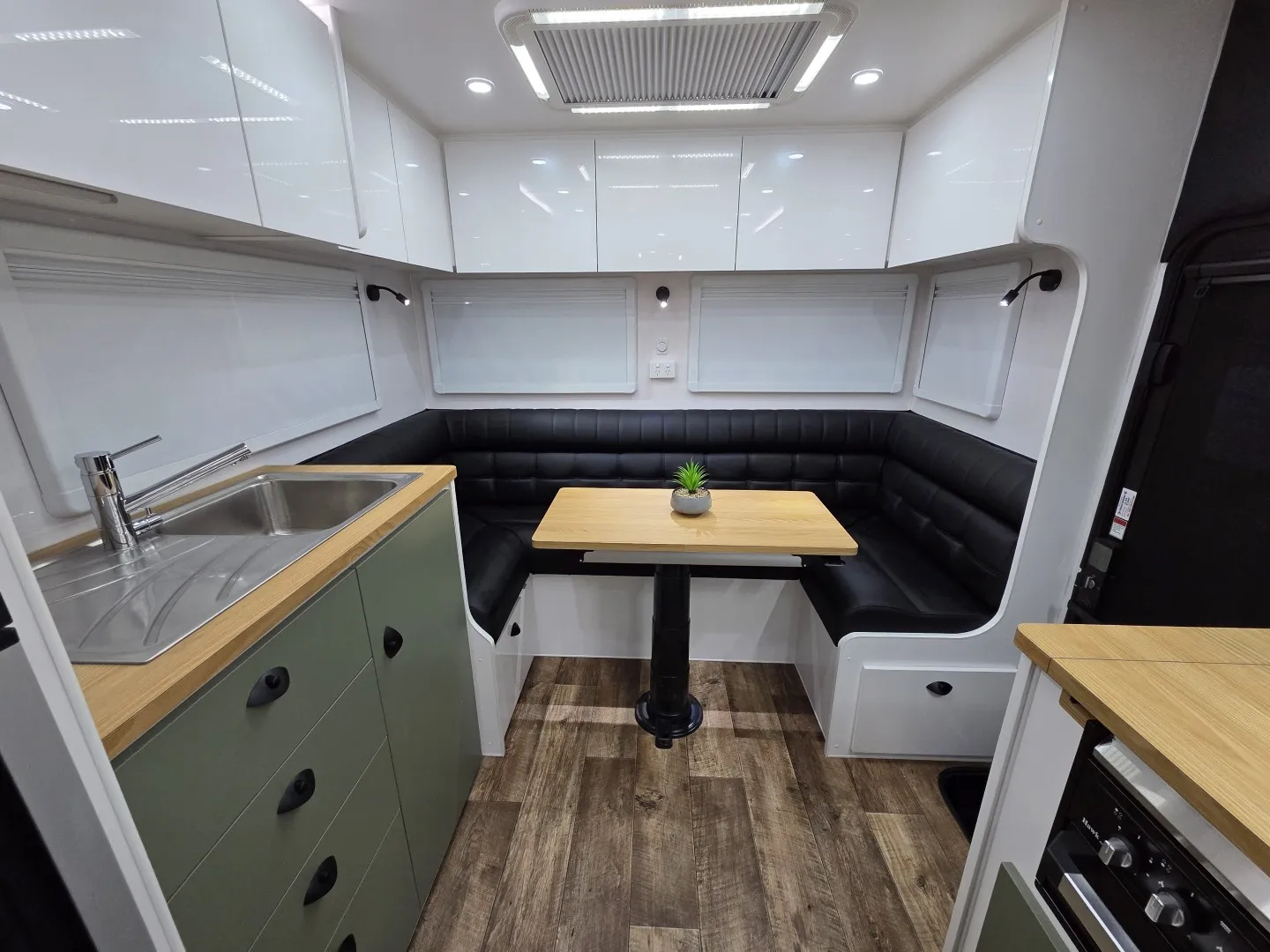 Kitchen and U-shaped dinette in a Safari Delta 20 Rear Club