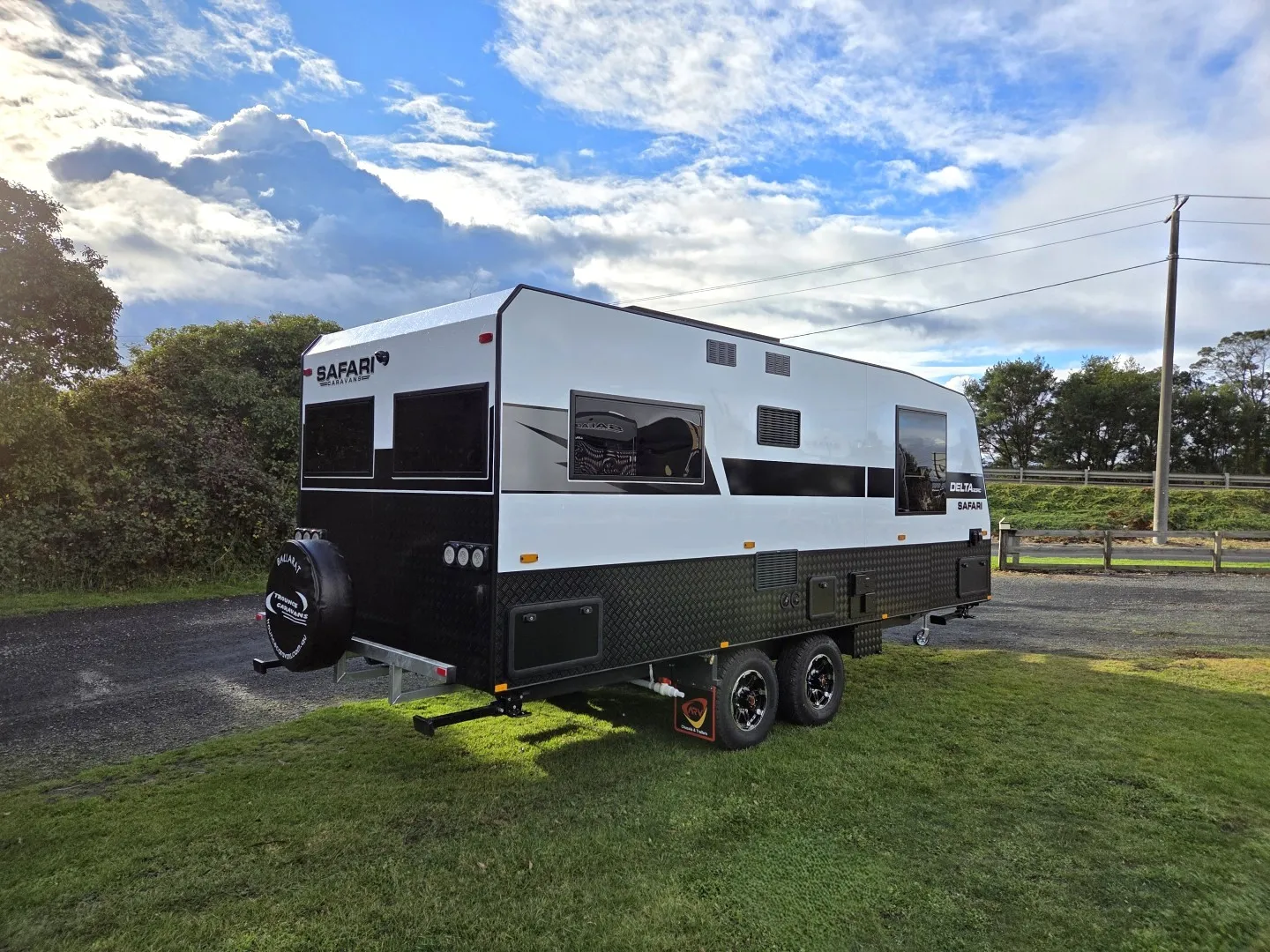Safari Delta 20 Rear Club caravan from the rear, showing spare wheel and tandem axles