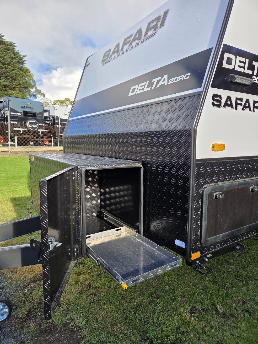 Safari Delta 20 Rear Club front checkerplate storage box open with slide-out tray