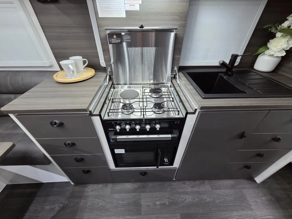 Safari Delta 226 Slide Out kitchen with gas cooktop, oven and black sink