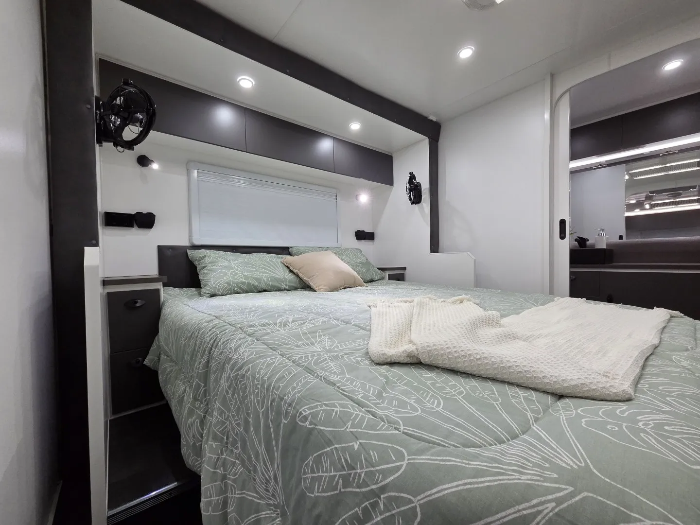Safari Delta 226 Slide Out queen bed with reading lights and side wardrobes