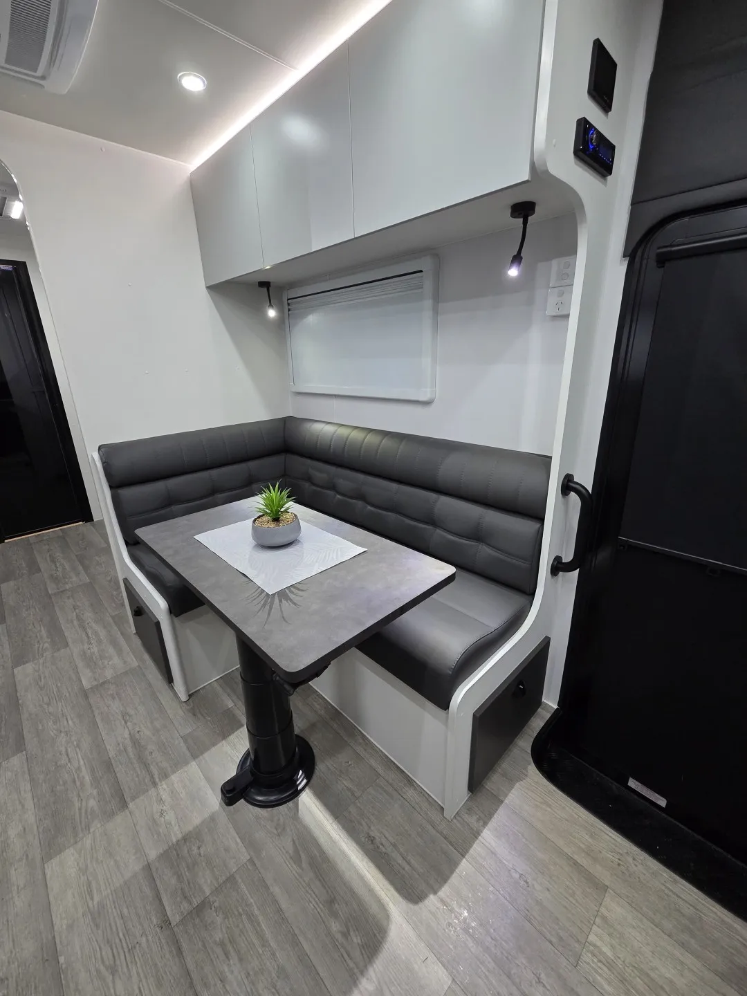 Safari Legacy 228 L-shaped dinette with grey leather seats and table
