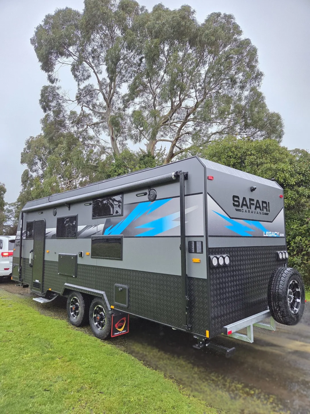 Safari Legacy 228 rear three-quarter view with spare wheel and checkerplate lower panels
