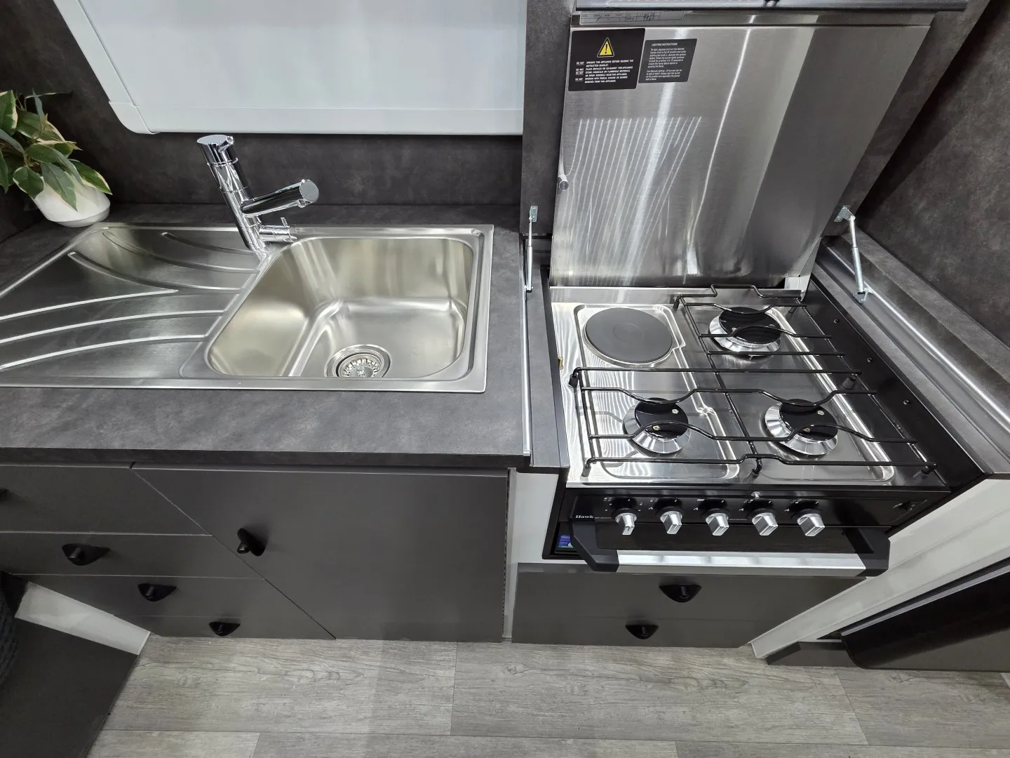 Safari Legacy 228 kitchen with stainless sink and four-burner cooktop