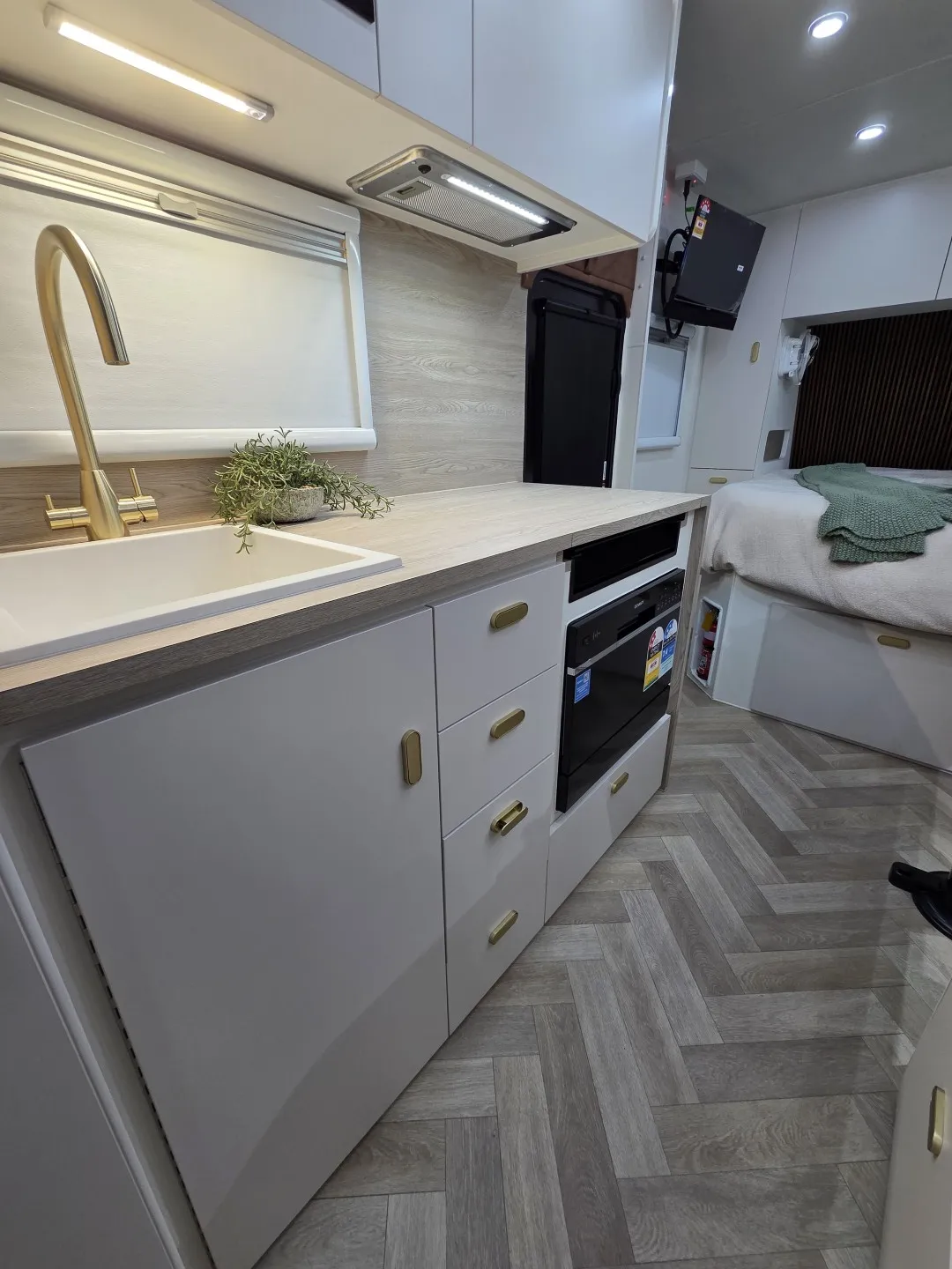 Kitchen with brass tap and herringbone floor in a Safari Tuff Roader-X