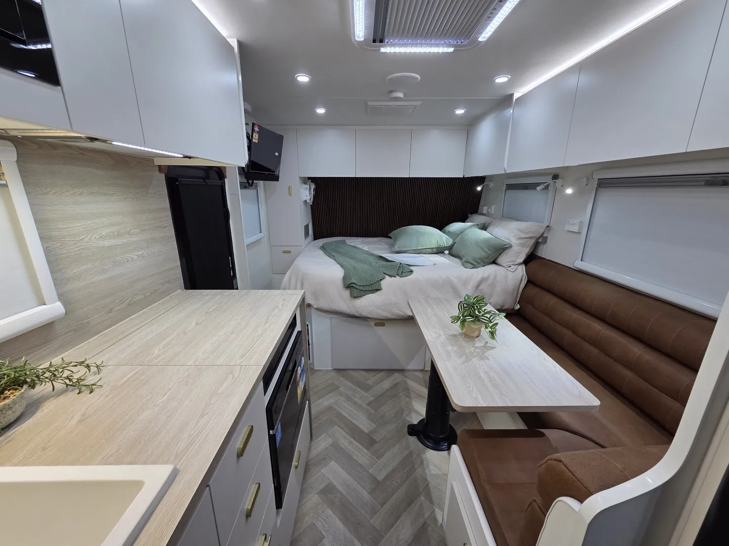 Safari Tuff Roader-X 21 interior looking forward past kitchen and dinette to the bed