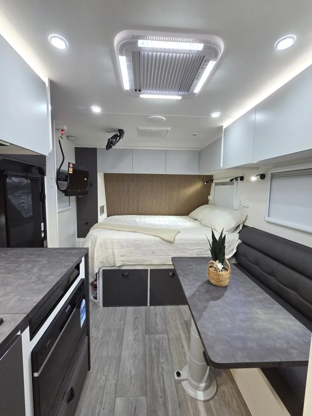 Safari Tuff Roader-X 228 interior looking past the dinette to the queen bed