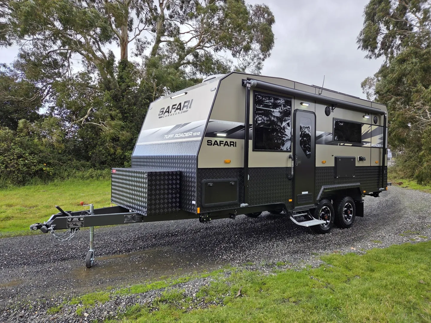 Safari Tuff Roader 1810 off-road caravan parked on a gravel track among gum trees