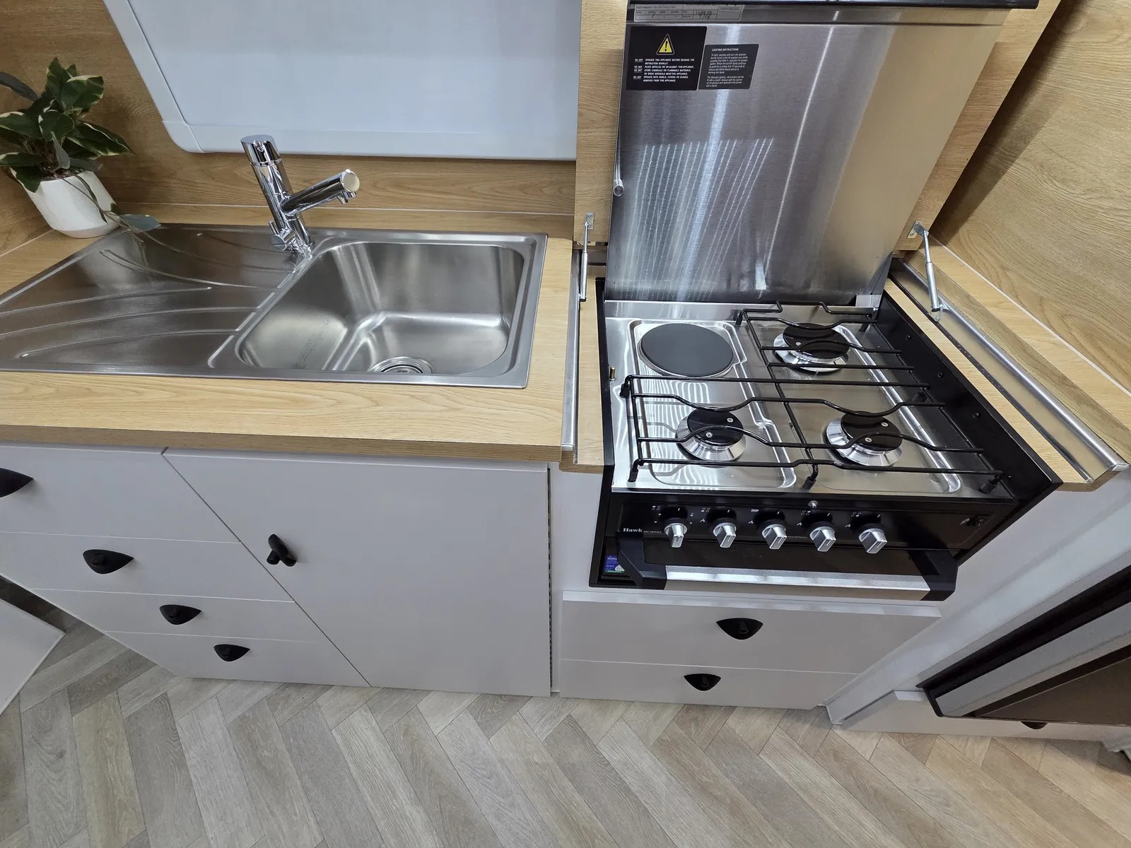Safari Tuff Roader 1810 kitchen with stainless sink and four-burner cooktop