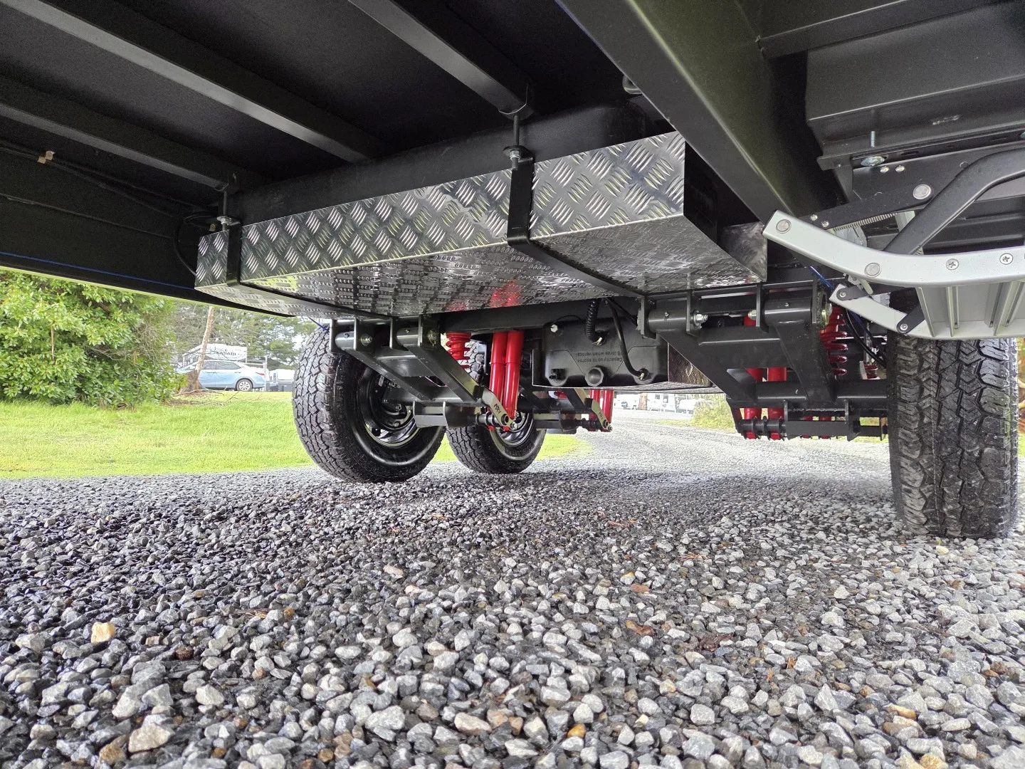 Safari Tuff Roader 1810 underbody showing independent suspension and checkerplate floor