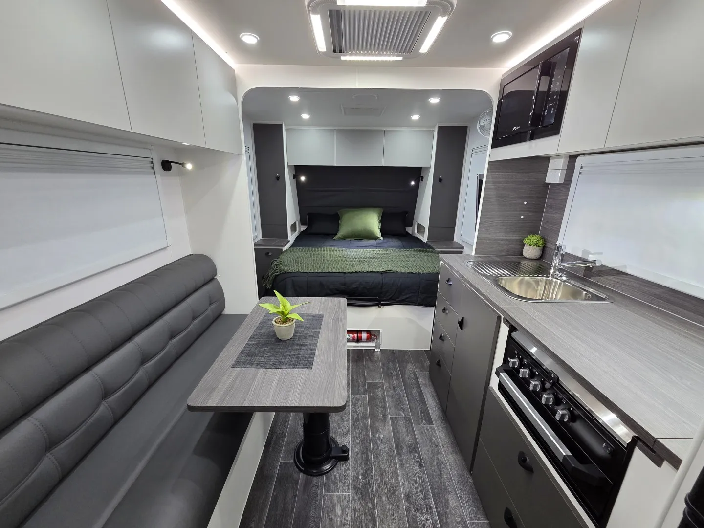 Safari X-Trak 176 interior looking past the dinette and kitchen to the bed