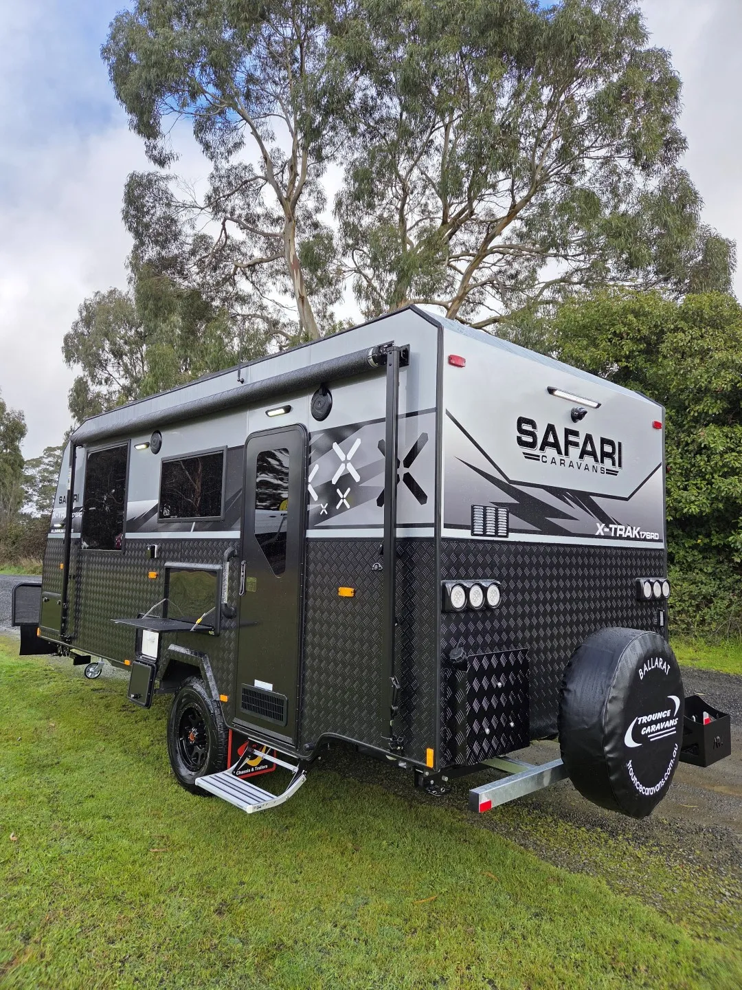 Safari X-Trak 176 rear three-quarter view with spare wheel and checkerplate