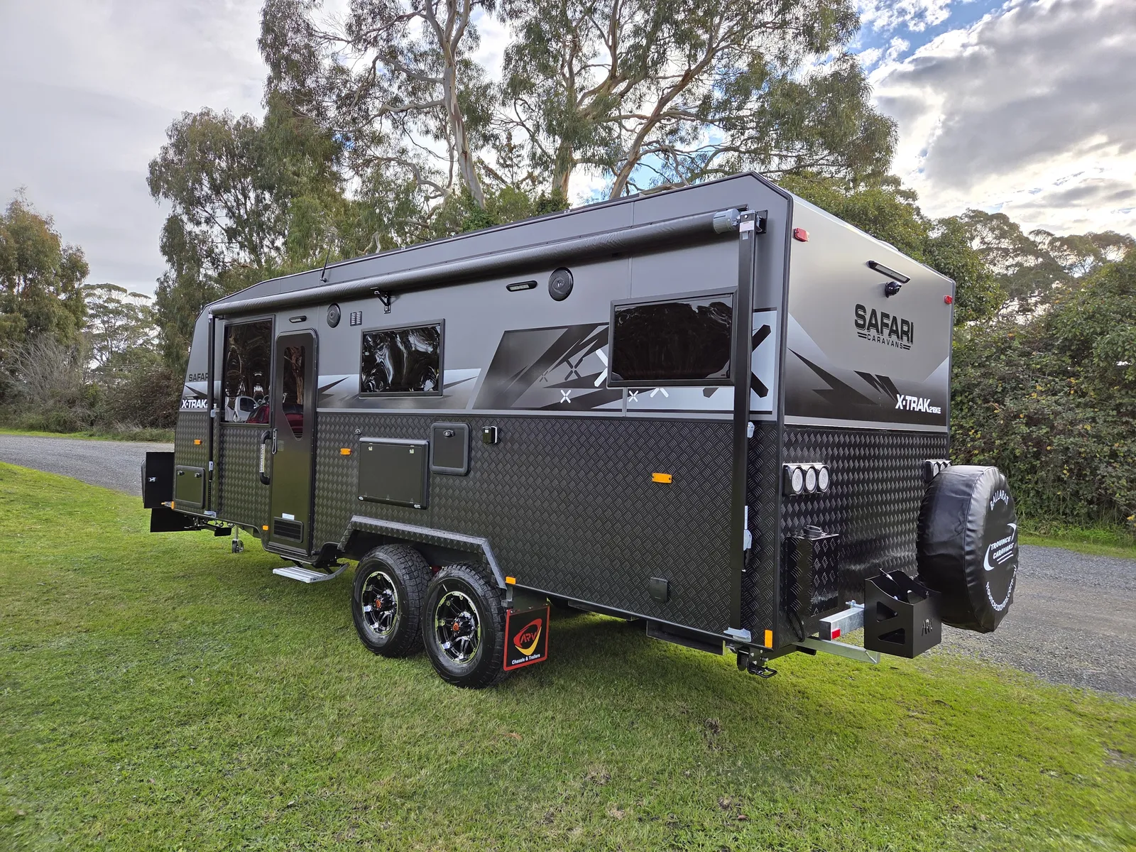 Safari X-Trak 216 KE rear three-quarter view with spare wheel and awning