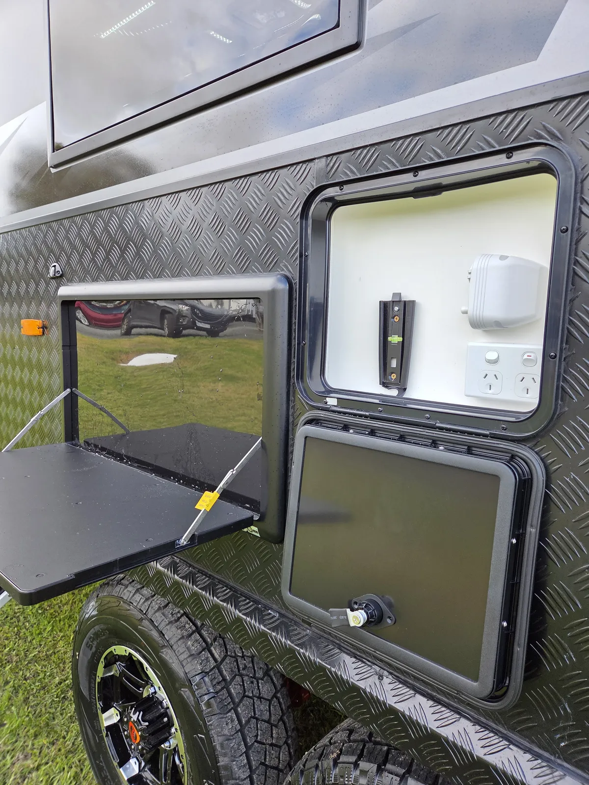 Safari X-Trak 216 KE external hatch with fold-out table and outdoor outlets